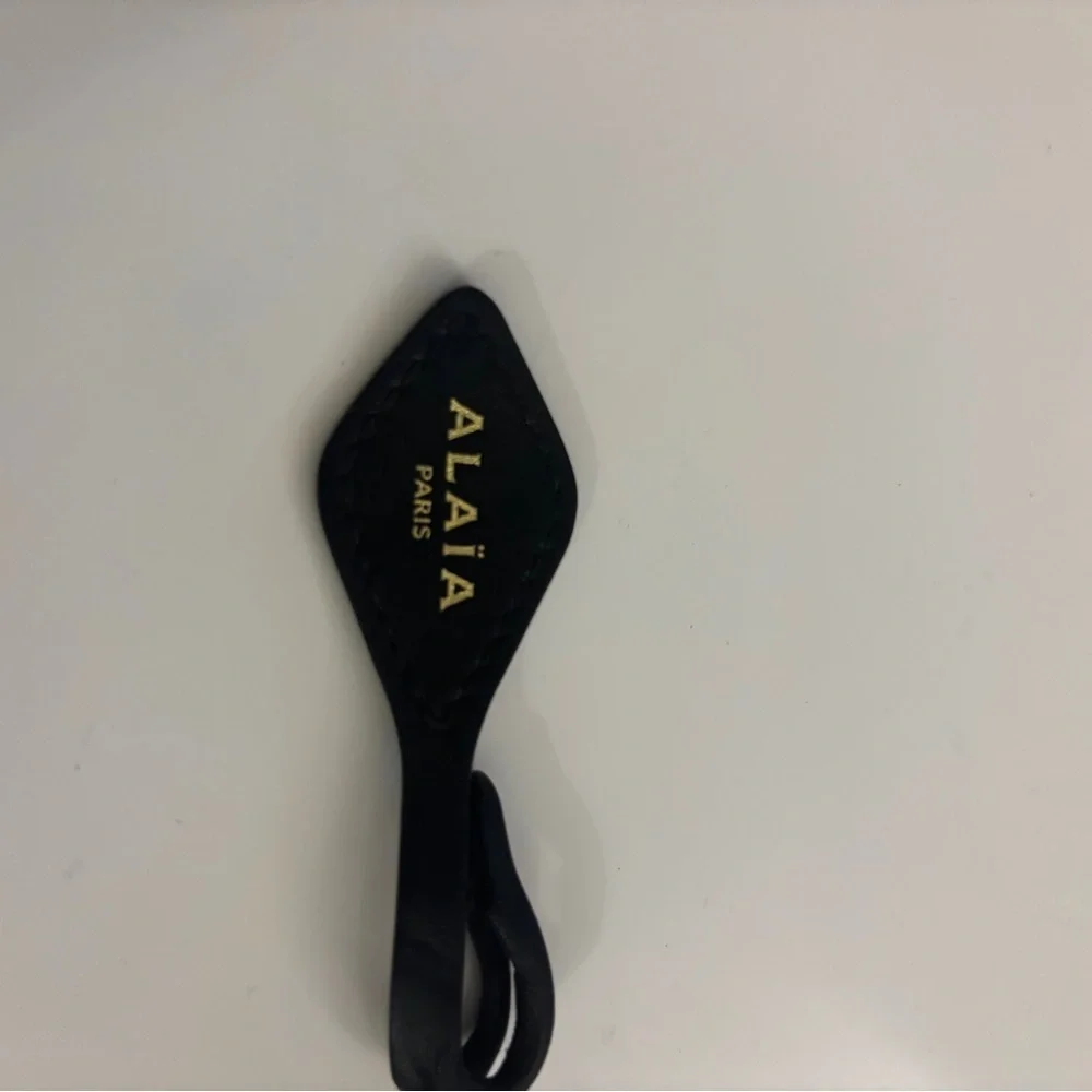 Alaia Black Leather Bag Tag